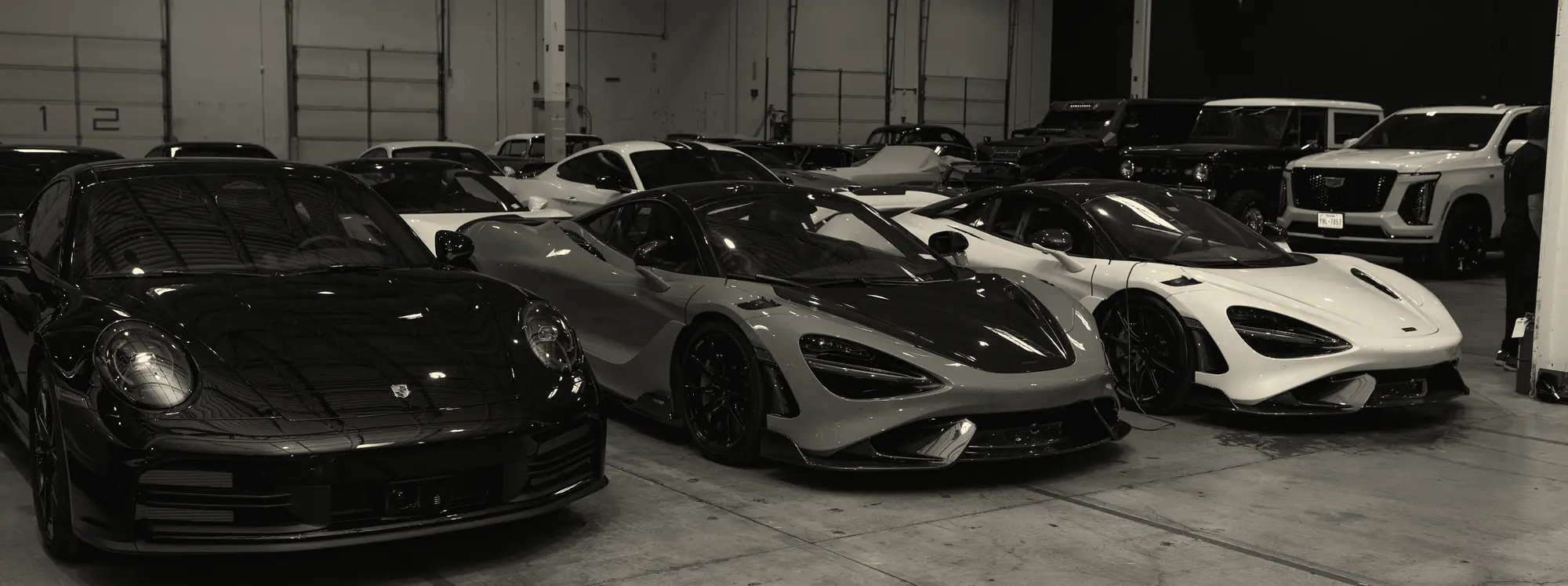 A row of supercars in the private gallery that hosted a recent Off The Grid evening