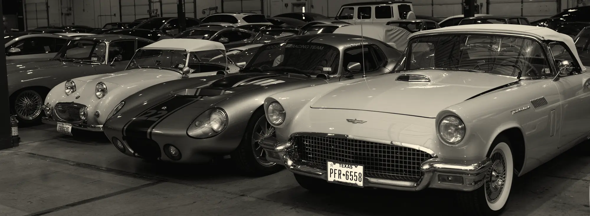 Classic cars lined up in the private gallery that hosted a recent Off The Grid evening