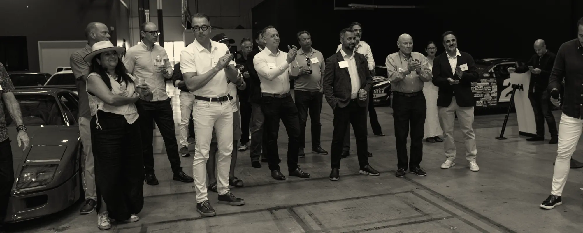 Guests gathered in a private car gallery during a recent Off The Grid evening in Austin